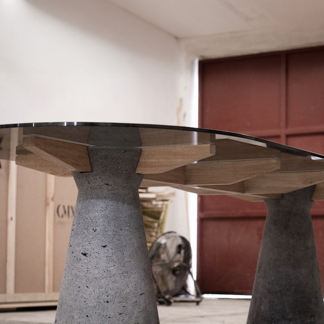 Dining table made of Lava Stone, solid wood and smoked glass