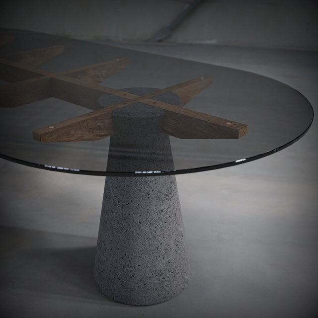 Dining table made of Lava Stone, solid wood and smoked glass