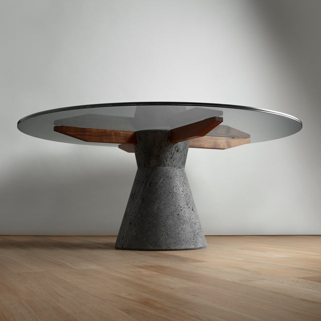 Stricta: Round dining table ideal for 8 to 10 made of Lava Stone, Solid Wood and Smoked laminated Glass.